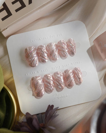 Velvet Twist press-on nails in short oval shape — Pink silver chrome swirl 3D sculpted glitter overlay