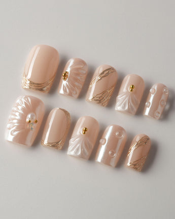Venus short square press-on nails with pearl nude base and 3D shell details