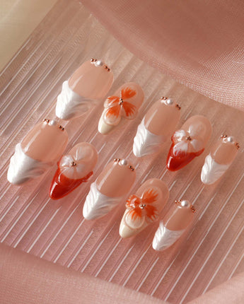 Duchess Marigold vibrant summer nails with marigold orange floral French tips