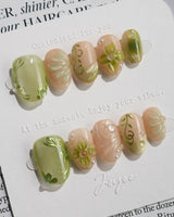 Vines - Sneaky Climber press-on nails in extra short oval shape — Fresh Avocado Green, Hand-painted Vines & 3D Flowers.