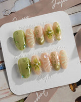 Vines - Sneaky Climber press-on nails in medium oval shape — Fresh Avocado Green, Hand-painted Vines & 3D Flowers.