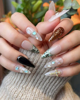 Vintage V nail set with vintage painted details, raised cross accents, and gemstone decor