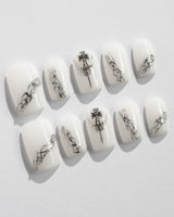 White metallic nails perfect for parties and celebrations.