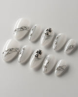 White metallic nails showcasing sleek and shiny designs