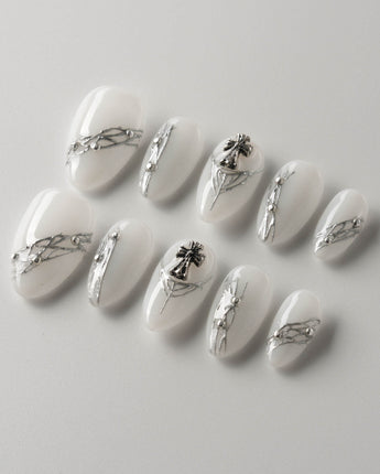 White metallic nails showcasing sleek and shiny designs