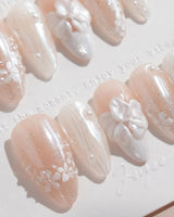White Musk press-on nails in medium almond shape — Ethereal Aurora White, 3D Flowers & Delicate Glitter effect