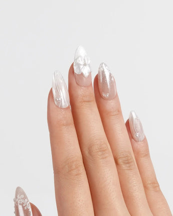 White Musk press-on nails in medium almond shape — Ethereal Aurora White, 3D Flowers & Delicate Glitter effect