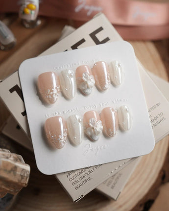 White Musk press-on nails in extra short almond shape — Ethereal Aurora White, 3D Flowers & Delicate Glitter effect