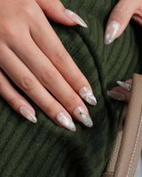 Snowfall press-on nails — pearl nude cat eye snowflake bow silver glitter soft sheen handmade nail art by Joyee Nails