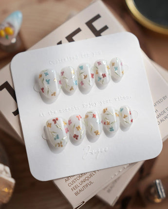 Wildflower press-on nails in extra short oval shape — Fresh Creamy White, Colorful Metallic Dainty Florals & Gold Wire Stems.