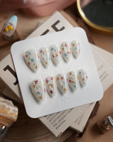 Wildflower press-on nails in short stiletto shape — Fresh Creamy White, Colorful Metallic Dainty Florals & Gold Wire Stems.