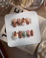 Winter Fawn nails in extra short almond — Caramel Brown & Creamy