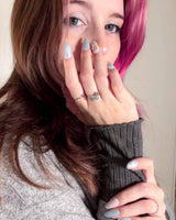 Winter wonderland handmade press-on nails featuring Icy Blue Snowflakes, Rhinestone Wreath & Hearts.