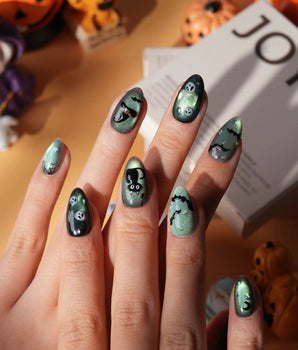 Witch's Cat press on nails with a black cat on a jack-o-lantern, witch hat, skulls, bats and a spider web on green shimmer cat eye - image 2