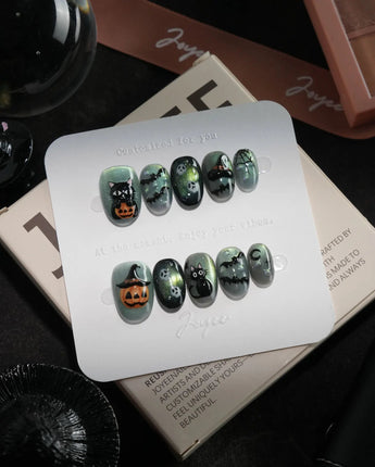 Witch's Cat handmade press-on nails in extra short oval shape by Joyee Nails