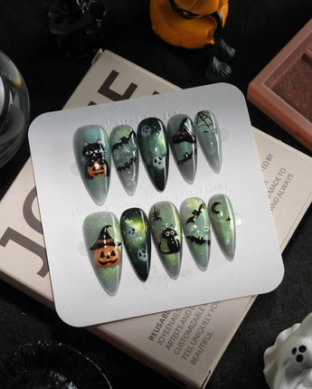 Witch's Cat handmade press-on nails in medium stiletto shape by Joyee Nails