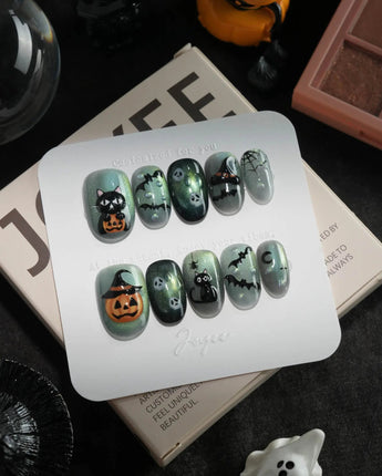 Witch's Cat handmade press-on nails in short oval shape by Joyee Nails
