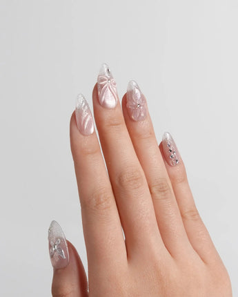 Wonderland nail art close-up showing Ethereal Pearl Pink Cat-eye, 3D Bows & Water Ripple Textures. details