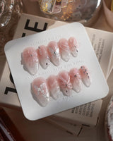 Wonderland press-on nails — Ethereal Pearl Pink Cat-eye, 3D Bows & Water Ripple Textures. handmade nail art by Joyee Nails