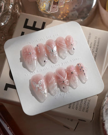Wonderland press-on nails — Ethereal Pearl Pink Cat-eye, 3D Bows & Water Ripple Textures. handmade nail art by Joyee Nails