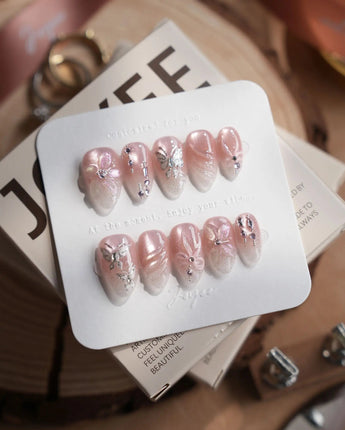 Wonderland press-on nails — Ethereal Pearl Pink Cat-eye, 3D Bows & Water Ripple Textures. handmade nail art by Joyee Nails