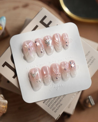 Wonderland press-on nails — Ethereal Pearl Pink Cat-eye, 3D Bows & Water Ripple Textures. handmade nail art by Joyee Nails