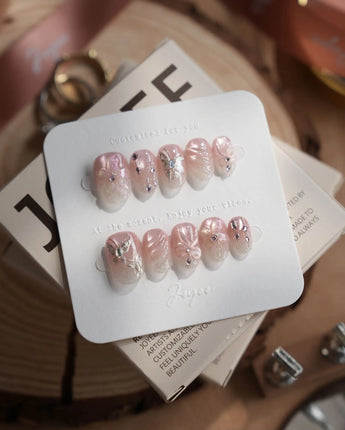 Wonderland press-on nails — Ethereal Pearl Pink Cat-eye, 3D Bows & Water Ripple Textures. handmade nail art by Joyee Nails