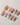 Nude base press-on nails featuring delicate 3D flowers and soft pastel tones

