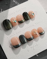 Woodland Sea in extra short squoval shape with dark green cat-eye tips and shell glitter