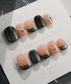 Woodland Sea press-on nails in extra short squoval shape — Dark Green Cat Eye, French Gold Line & Shell Glitters.