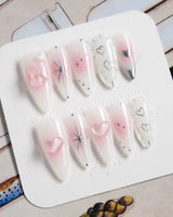 Y2K Love nail art close-up showing pink aura 3D heart soft gloss nails details