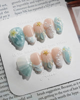 Yasawa Blue close-up of pearl beachcore nails with blue-white cat-eye shimmer