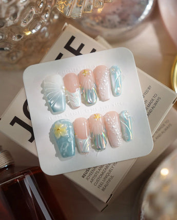 Yasawa Blue medium coffin nails with pearly blue-white shimmer, shells, and starfish